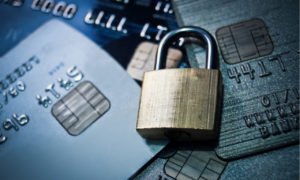 metal lock on pile of credit cards
