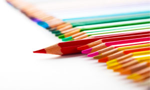 Colored pencils with rd pencil sticking out