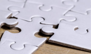 wrong puzzle piece in white puzzle