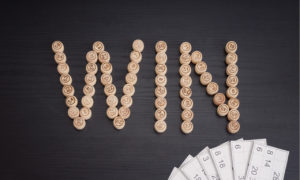 wooden Lotto tiles spelling WIN