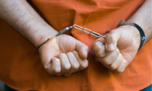 person hands handcuffed