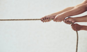 hands pulling a rope