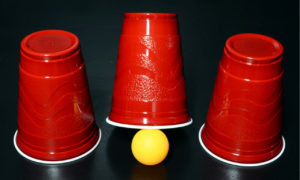 cups playing shell game