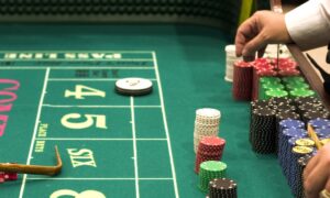 craps table dealers hands with chips