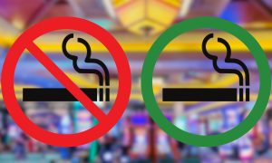 Smoking allowed and not allowed symbols in front of blurred casino floor background for story on experiences at smoking vs. non-smoking PA casinos