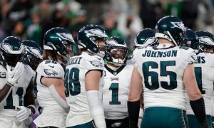 Photo of the Philadelphia Eagles' offensive huddle for a story about Pennsylvania online casinos offering crossover promos for the Eagles game and rest of the NFL playoffs.