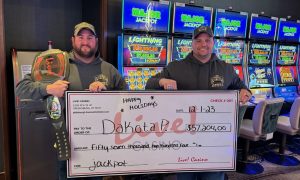 Photo of a jackpot winner from Live! Casino Pittsburgh for a story about the top jackpots earned at Pennsylvania casinos in December 2023.