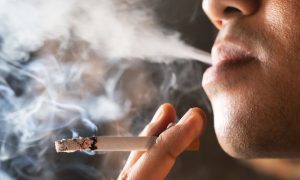 Close-up of a man smoking a cigarette. Harrah's Philadelphia has been denied the opportunity to go smoke-free after Ceasars' board voted against a shareholder proposal.