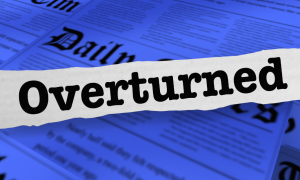 a newspaper clipping with the word "overturned" over the top of other newspaper articles