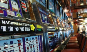 a row of slot machines in a casino